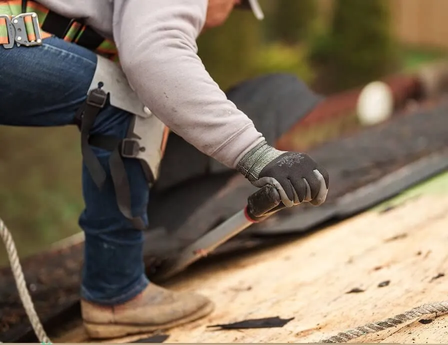 Sunnyside Roofing professional working on a roof ventilation system
