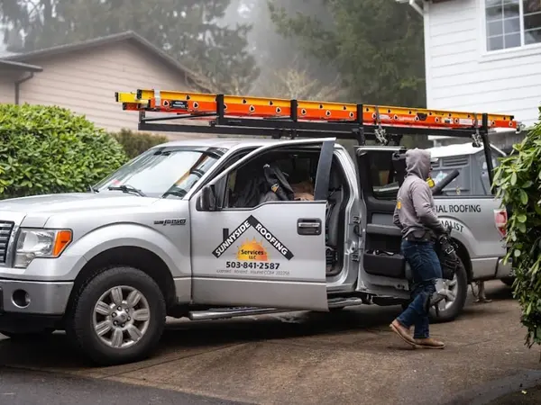 Sunnyside Roofing truck and technician working on residential home